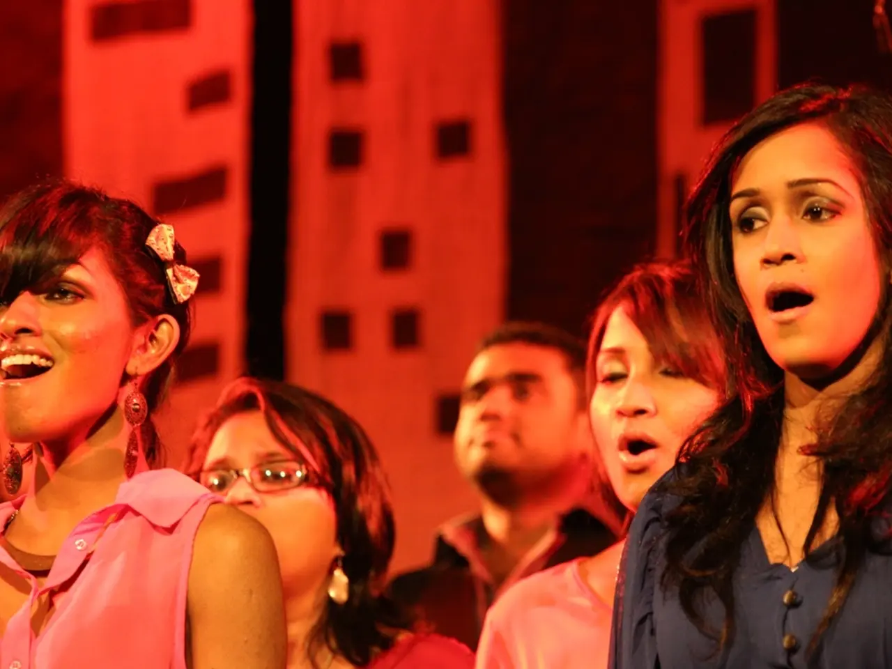 Nicole Scherzinger dazzles in a vibrant red outfit, capturing everyone's attention with her...