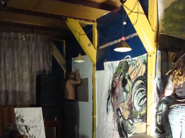 Here we can see people, curtains, speaker, lights, buckets, bottle and boards. On these boards...